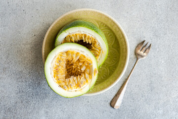 Plate with halves of passion fruit