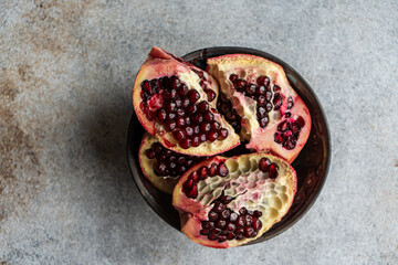 Raw organic pomegranate in the bowl