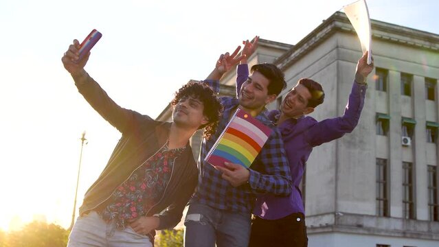Three young gays celebrating pride lifestyle at university.