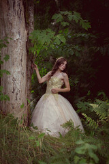 Beautiful Princess in Gown Waiting in Forest