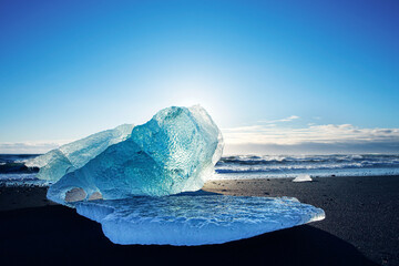 Iceberg stranded on a black beach