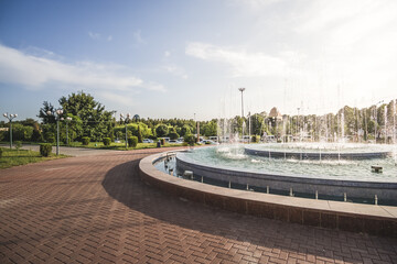 City park in the ancient city of Samarkand in Uzbekistan, oriental architecture and fountain