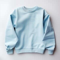 Light blue color crew-neck sweatshirt lying flat and folded on top of a white background