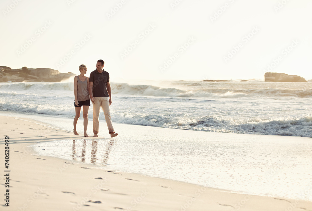 Poster Couple, talking and beach at sunset for romantic date, weekend getaway or vacation in Indonesia. Happy woman, man or people in love with smile for evening walk, bonding and relaxation by shore