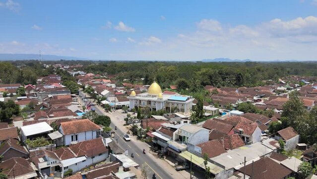 Drones above the village surround the mosque in the center of the village