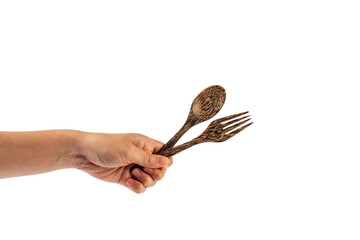 Wooden spoon and wooden fork in hand isolated on transparent background.