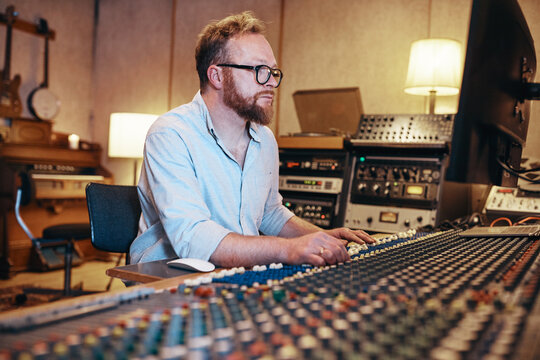 Music producer at work in his recording studio