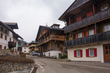 Obraz premium Traditional wooden houses in the historic mountain village of Cima Sappada in Carnia in Udine Province, Friuli-Venezia Giulia, north east Italy