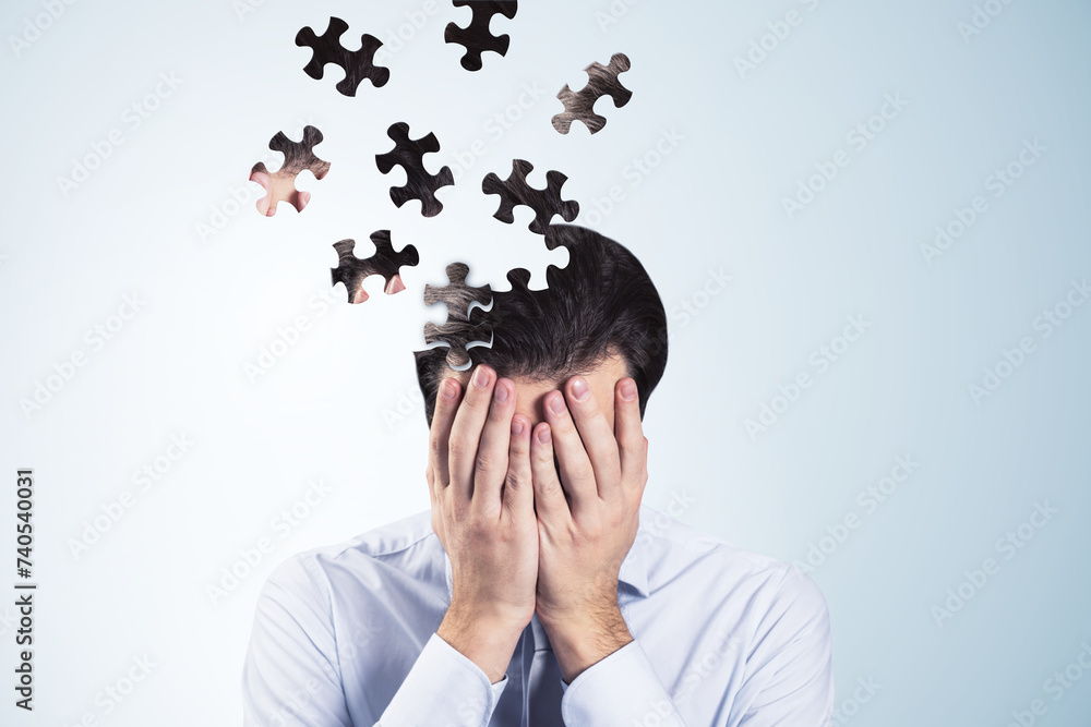 Aufkleber worried puzzle headed thoughtful businessman covering face with hands on light background with mock 