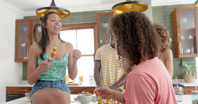Diverse friends enjoy a casual gathering at home