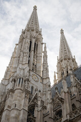 Fototapeta na wymiar Newly renovated neo-Gothic Votive Church (Votivkirche) in Vienna, Austria