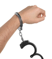 Freedom concept. Man with handcuffs on his hand against white background, closeup