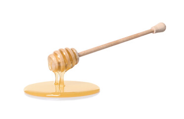 Natural honey dripping from dipper on white background