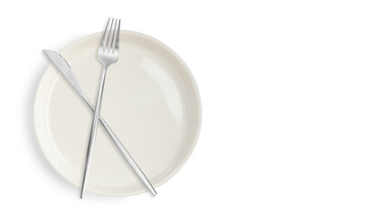 Clean plate, fork and knife on white background, top view