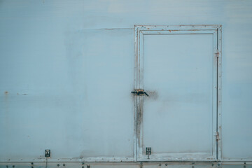 Old worn door of a refrigerated truck trailer