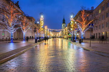 Beautiful architecture of the Royal Route with Christmas illuminations in Warsaw. Poland - obrazy, fototapety, plakaty