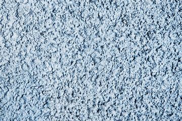 Grunge cement wall. Concrete texture. Closeup stucco wall. Blue paint cracked background. Rough structure. Plaster closeup. Vintage macro backdrop.