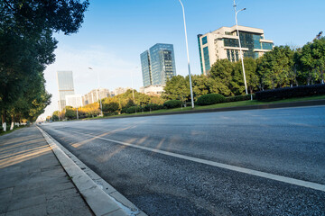 Empty urban road and buildings in the city - 740558845