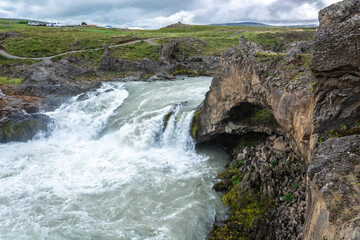 Fototapeta na wymiar waterfall in the mountains, godafoss aterfall iceland