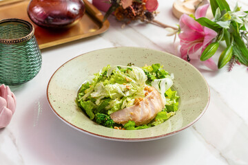 Salad with chicken, cabbage, lettuce and nuts. Lunch.