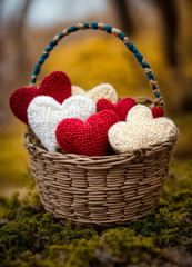 Fototapeta na wymiar Knitting threads in a heart basket. Selective focus.