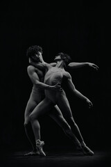 Artistic, talented young man and woman in pointe, ballet dancers performing passionate dance....