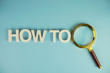 How to alphabet letters with magnifying glass on blue background