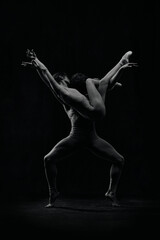 Expressive, artistic man and woman , ballet dancers making sensual, passionate performance, dancing. Black and white. Concept of classic art, aesthetics, emotions, ballet dance, talent