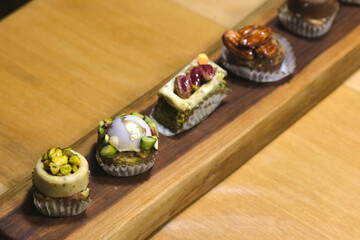Small sweet bites, arranged on a wooden board