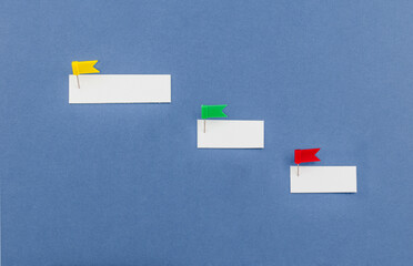 Blank paper notes are pinned to board. Business management and business solutions. Overcoming the barriers. Conquering the obstacles. Way to success.