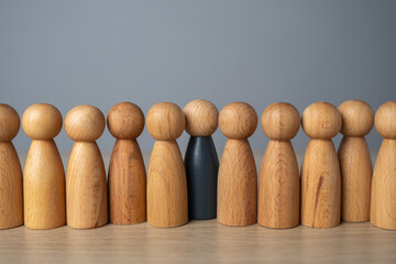 A man in dark is hiding in the crowd. Burnout at work. A replacement is required for an open...