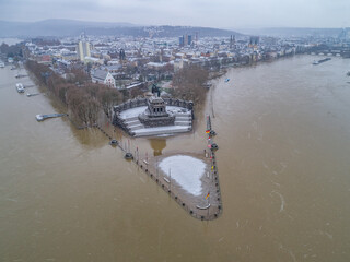 Flooding high water Koblenz Germany historic monument German Corner winter where rivers rhine and mosele flow together - 740593823