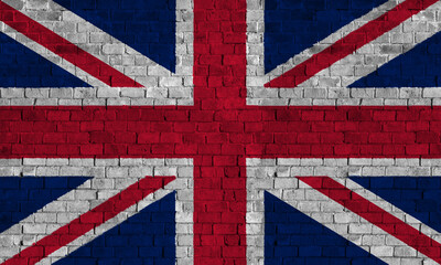 United Kingdom Flag Over a Grunge Brick Background.