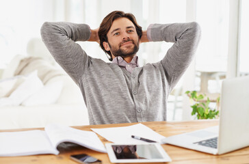 Naklejka premium Businessman, relax and smile with laptop at home for remote, freelance work and internet research. Male person, hands and head for break, wellness and technology in home office for online job