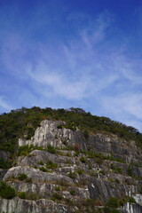 Fototapeta na wymiar 石切山脈（いしぎりさんみゃく）は日本の茨城県笠間市にある日本最大の稲田石の採石場。