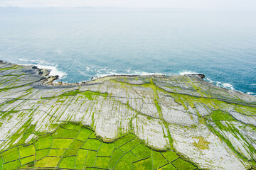 Aerial view of Inishmore or Inis Mor, the largest of the Aran Islands in Galway Bay, Ireland....