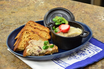 Creamy pork liver pate served with toasted bread.