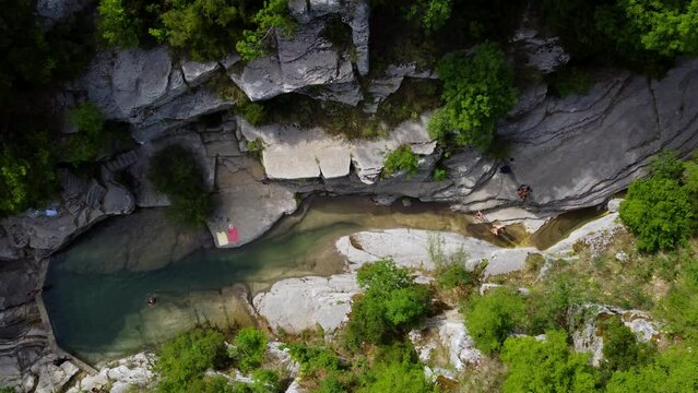 Birds eye view of swimming in a natural Papingo Rock Pools in Greece