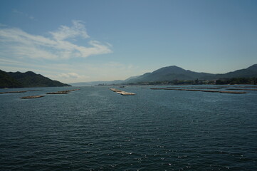 Hiroshima bay view from ferry boat crossing the inland sea between Miyajimaguchi Pier and Miyajima island, JAPAN.