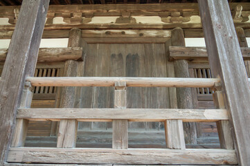 Wooden fences and windows of Senjokaku Pavilion (Hall of One Thousand Tatami Mats) on Miyajima Island in Hiroshima, Japan.