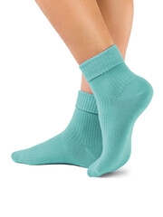 Side view of beautiful woman foot dressed in new nice and soft natural cotton fabric blank green socks