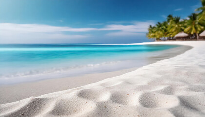 Pristine white sandy beach meets tranquil turquoise ocean under a serene blue sky with lush greenery