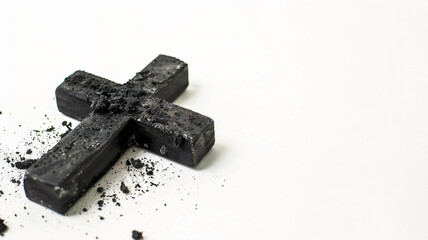 Black cross with ashes on white background. Cremation funeral liturgy religious ceremony