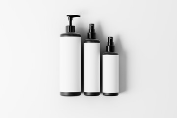 three cosmetic bottle mockup set featuring two spray bottles and a pump bottle.