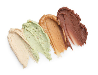 Samples of different nut butters isolated on white, top view