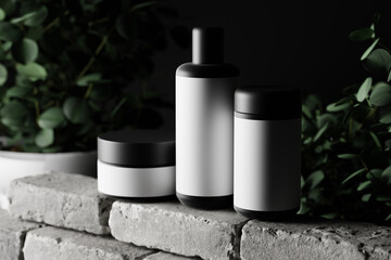 cosmetic packaging mockup set featuring a bottle, a tall jar and a flat jar.