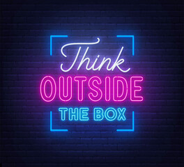 Think outside the box - neon lettering on brick wall background