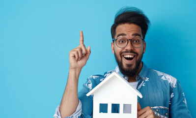 Fototapeta na wymiar real estate agent showing house model , on a blue background