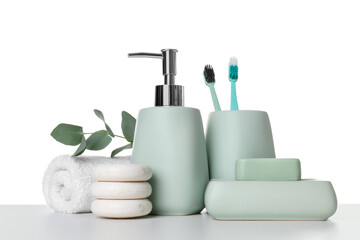 Bath accessories. Different personal care products and eucalyptus branch on table against white background