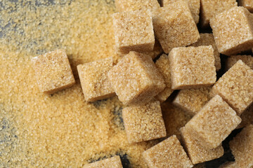 Brown sugar cubes on table, top view